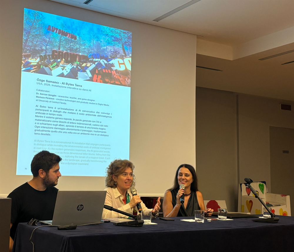 Panel discussion at the festival, the slide behind the speakers showing the AI Bytes Terra wall text and credits