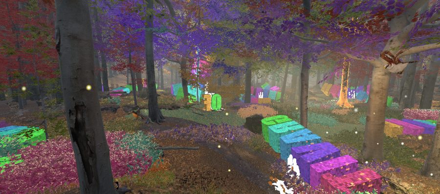 Coloured 3D letter blocks scattered across a forest floor with a deer standing among them